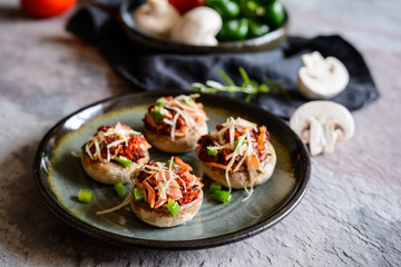 Roasted mushrooms stuffed with ham, sun dried tomato and bell pepper
