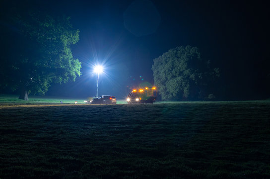 Emergency Recovery Truck And A Broken Down Vehicle At Night