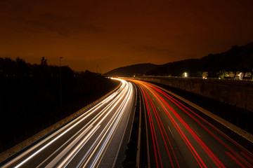 Fototapeta na wymiar Commuting Traffic Light Trails in Highway at Night Close to Barcelona (Spain)