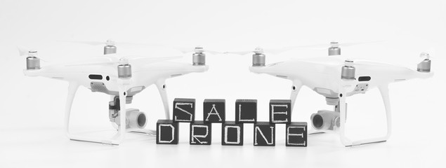 Flying drones on black background. Theme selling and buying drone