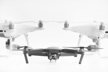 Flying drones on black background. Theme selling and buying drone