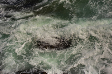 Waves during a storm. View from above. Red code. Rest on the Black Sea coast in Bulgaria. Elemental force.