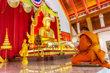 UBONRATCHATHANI, THAILAND - 20 NOVEMBER 2018 : A monk was praying at evening in Mahawanaram temple.