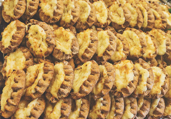 A lot of pieces of cake with curd