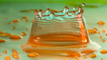 Drops of rain fall into the water, selective focus close-up