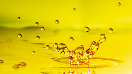 Drops of rain fall into the water, selective focus close-up