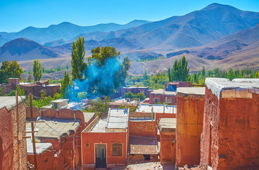 Enjoy the landscape of Karkas mountains from the terrace adobe village of Abyaneh with preserved...