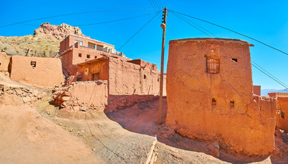 Observe preserved medieval architecture of Abyaneh - the clay village in Karkas mountains, located...