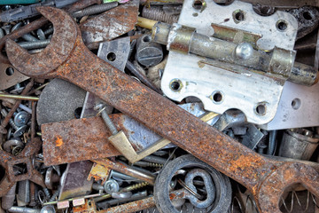 Rusty wrench is in a box with tools