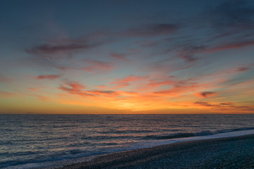 Beautiful dramatic sunset against the sea.