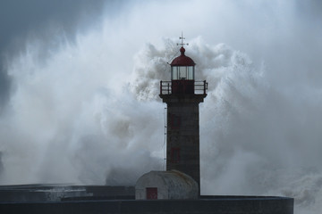 Big storm with big waves near a lighthouse - 235006416