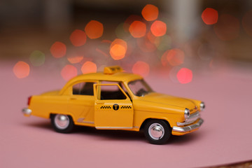 Obraz na płótnie Canvas taxi toy car . background