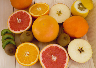 citrus fruits on wooden background close up