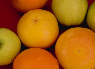 citrus fruits on a colored background close up