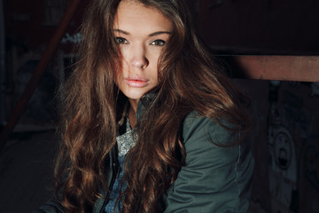 Fototapeta premium Beautiful brunette with her hair down.Photo outside in cool weather