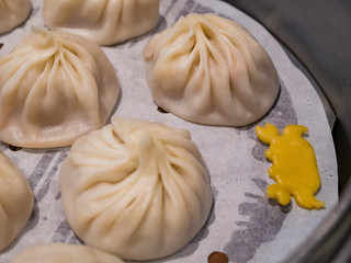 Close up shot of a Chinese style pork Xiao Long Bao