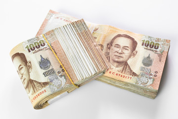 Thai baht banknote. Business and Finance concept. Bulk of banknote on white background.