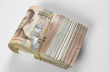 Thai baht banknote. Business and Finance concept. Bulk of banknote on white background.