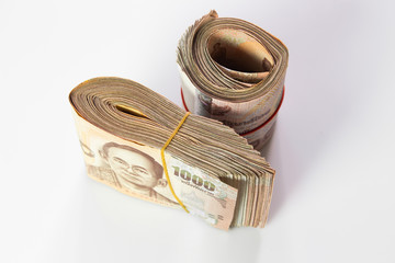 Thai baht banknote. Business and Finance concept. Bulk of banknote on white background.