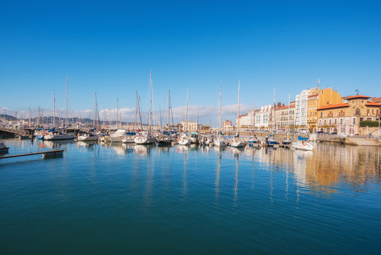 Gijon cityscape. Yatchs in marina port of Gijon, Asturias, Spain.