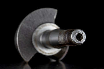 Crankshaft of a four-stroke diesel engine on a metal table. Spare parts for car repair.