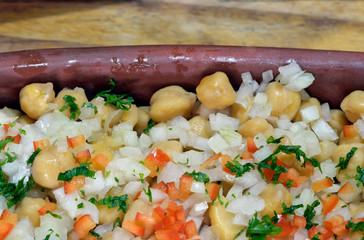 Tray of cooked chickpeas salad with onions