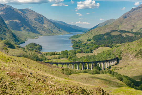 View over Glenfinnan viaduct to Loch Shiel with Prince Charlie monument 
