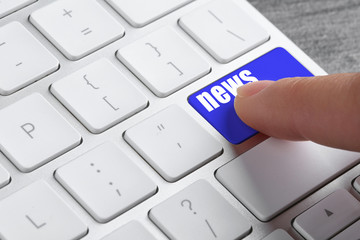 Woman pressing button on computer keyboard, closeup