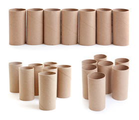 Set with empty paper toilet rolls on white background