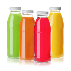 Set with glass bottles of different juices on white background