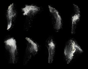 Set with splash clouds of wheat flour on black background