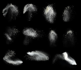 Set with splash clouds of wheat flour on black background