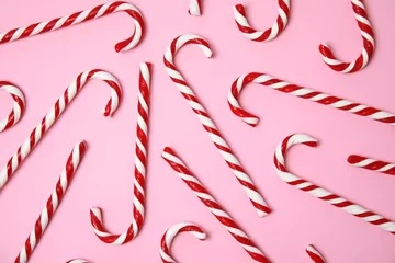 Fotobehang Flat lay composition with tasty candy canes on color background © New Africa