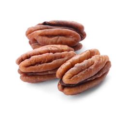 Ripe shelled pecan nuts on white background