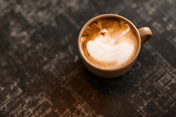 Cup of delicious freshly made coffee and space for text on table