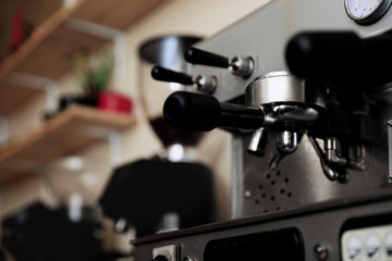 Fototapeta na wymiar Modern electric coffee machine with portafilter, closeup