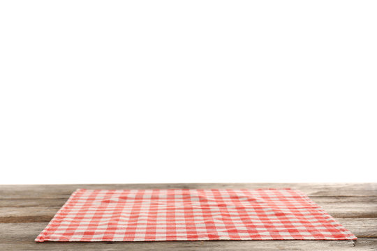 Checkered napkin on table against white background