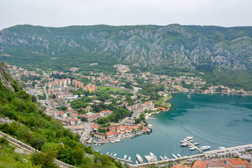 Naklejka na ściany i meble The Kotor bay is the notable landmark, that boasts beautiful landscapes, cozy beaches and medieval architecture of its old towns and villages, Montenegro.