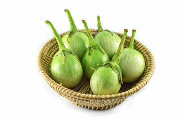 green eggplant isolated on white background / thai green eggplant in basket harvest vegetable garden