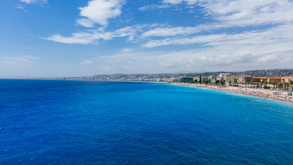 Fototapeta na wymiar Buildings and beaches next to blue sea in Nice, France