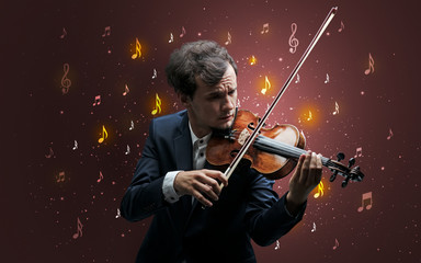 Young violinist with falling musical notes wallpaper and classical concept