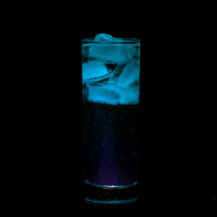 Blue Sparkling iced alcohol drink with isolated black background