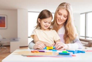 Happy Mother and daughter drawing