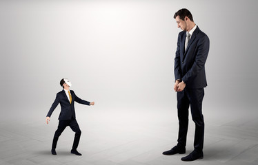 Conflict between small masked businessman and big elegant businessman
