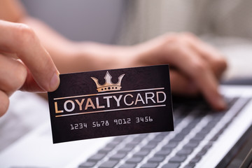Close-up Of A Man Holding Loyalty Card