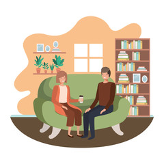 couple in living room drinking coffee