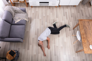 Unconscious Man Lying On Floor