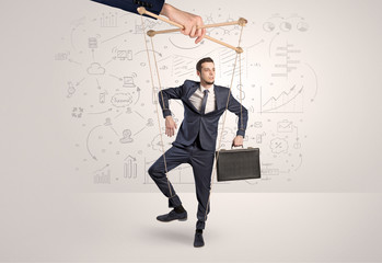 Little businessman controlled from above like a puppet concept
