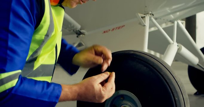 Engineer reparing aircraft wheel