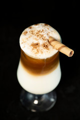 Alcoholic coffee cocktail with coffee liqueur, fresh cream and milk